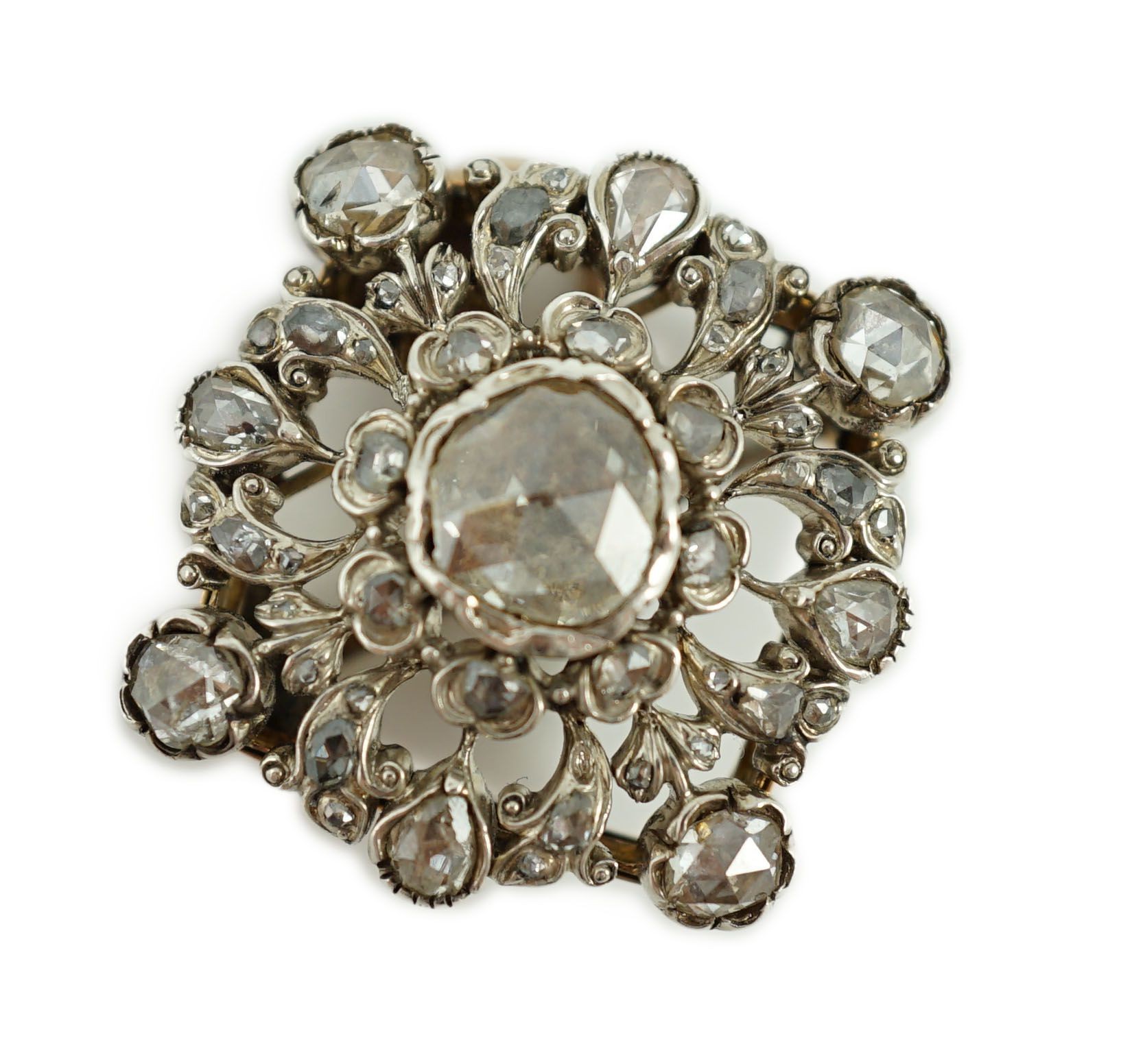A Victorian pierced gold, silver and rose cut diamond set pendant brooch